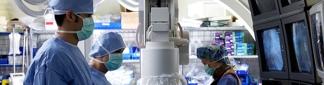 doctors team looking at medical devices